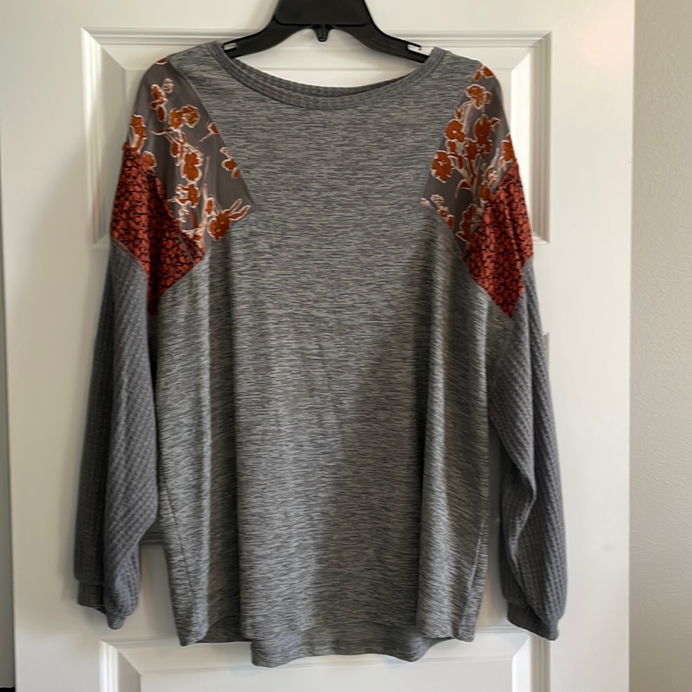 Long sleeve shirt. Waffle sleeves. Runs large.  Boutique shirt.